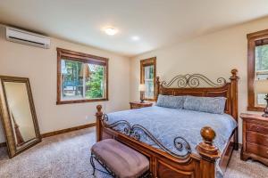 a bedroom with a wooden bed and two mirrors at Lake Cabins Lodge in Ronald