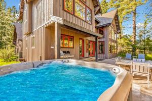 a house with a large swimming pool in the yard at Wine Down in Cle Elum
