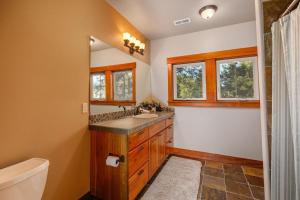 a bathroom with a sink and a toilet and a tub at Monabel Manor in Cle Elum +46 photos