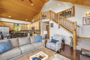 a living room with a couch and a staircase at Vista Ridge in Ronald