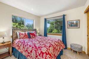 a bedroom with a bed and two windows at Vista Ridge in Ronald +38 photos