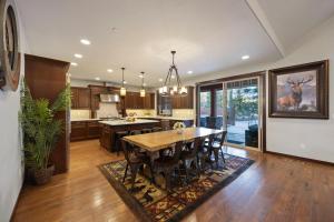 a kitchen with a table and a dining room at Basecamp at Suncadia in Cle Elum