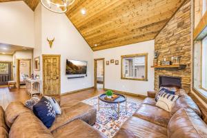 a living room with a couch and a fireplace at Norwester Stay in Ronald