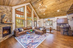 a living room with a couch and a fireplace at Norwester Stay in Ronald