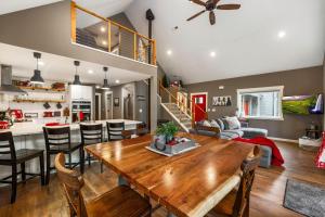 a kitchen and living room with a wooden table at Crimson Cabin in Ronald