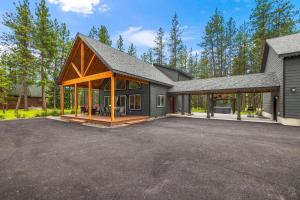 a home with a large garage and a house at Crimson Cabin in Ronald