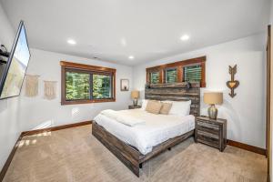a bedroom with a bed and a window at Cabin at the Crest in Ronald