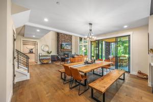 a dining room and living room with a table and chairs at Pine Meadow Lodge in Cle Elum