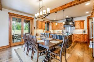 a kitchen with a wooden table and chairs at Twin Links in Cle Elum