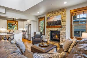 a living room with a couch and a fireplace at Ridgeview in Cle Elum