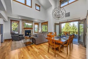 a living room with a table and chairs and a fireplace at Ridgeview in Cle Elum