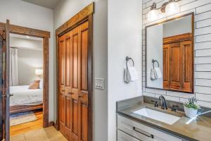 a bathroom with a sink and a mirror and a bedroom at Ridgeview in Cle Elum +31 photos