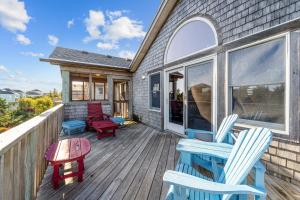 a deck with two chairs and a table and chairs at 7834 - Royal - T in Frisco