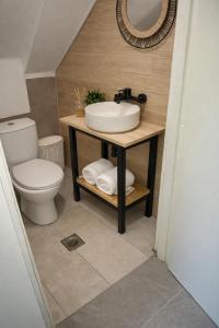 a bathroom with a sink and a toilet at garden home in Gaios
