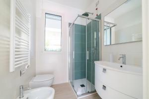 a bathroom with a sink toilet and a mirror at Camilla al mare in Tortoreto Lido