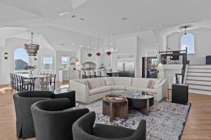 a living room with a couch and a table at 2876 - The Blue Martini in Duck