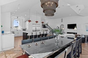a kitchen and dining room with a table and chairs at 2876 - The Blue Martini in Duck +72 photos