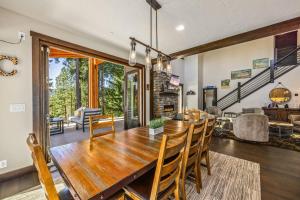 a dining room and living room with a table and chairs at 281 Big Rock in Cle Elum