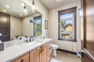 a bathroom with a sink and a toilet and a window at 281 Big Rock in Cle Elum +48 photos