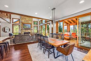 a dining room and living room with a table and chairs at Three Pines in Cle Elum