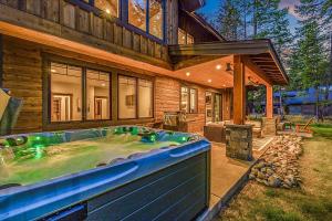a large hot tub in the backyard of a house at Suncadia Craftsman in Cle Elum