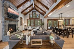a living room with a couch and a fireplace at Suncadia Craftsman in Cle Elum