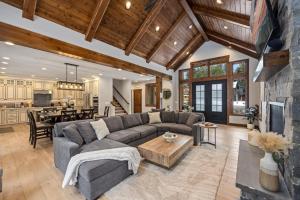 a living room with a couch and a table at Suncadia Craftsman in Cle Elum