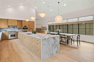 a large kitchen with a table and a dining room at Humble House in Cle Elum