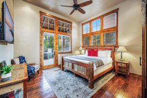 a bedroom with a bed and a ceiling fan at Tin Cup in Cle Elum
