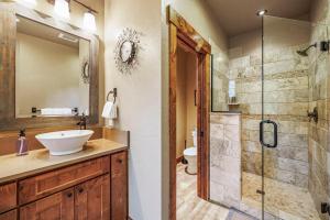 a bathroom with a sink and a shower at Tin Cup in Cle Elum +42 photos