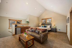 a living room with a bed and a couch at Tin Cup in Cle Elum