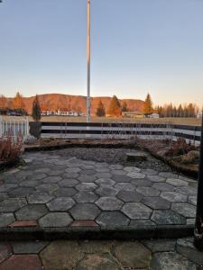 a flag pole in the middle of a patio at SelfossCenter flat in Selfoss