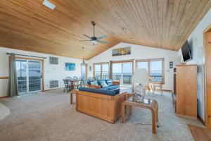 a living room with a couch and a table at 2931 - Lighthouse in Duck