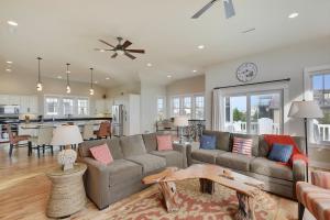 a living room with a couch and a table at 4108 - New Beginnings in Duck