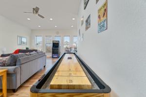 a living room with a pool table on the floor at 4108 - New Beginnings in Duck