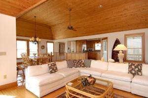 a living room with a couch and a table at 2408 - Herring Gull in Duck