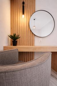 a mirror sitting on a counter in a salon at Mardinik Hotel Apartments in Rethymno