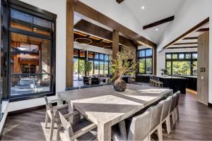 a dining room with a large wooden table and chairs at Grand Retreat in Cle Elum