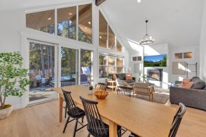 a dining room and living room with a table and chairs at Sun Seeker in Cle Elum