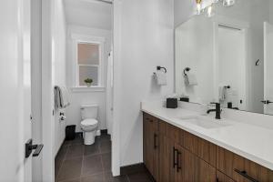 a white bathroom with a sink and a toilet at Sun Seeker in Cle Elum +42 photos