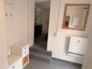 a room with a staircase and a mirror on the wall at Ferienwohnung Cookie in Elxleben