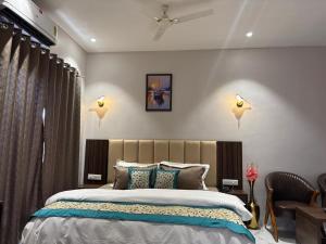a bedroom with a large bed in a room at Hotel Blue Ocean in Bharweli