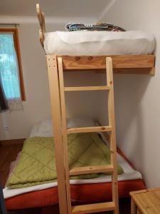 a bunk bed with a ladder and a bunk bed at ZEcamping 3 étoiles avec piscine et pataugeoire in Saint-Projet +27 photos