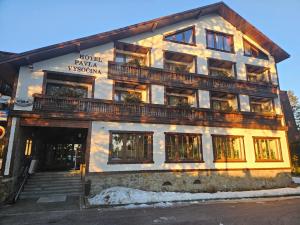 a building with a balcony on the side of it at Hotel Pavla Vysočina in Nové Město na Moravě