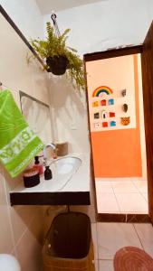 a bathroom with a sink and a mirror at Bossa Nova Home in Barra dos Coqueiros +29 photos