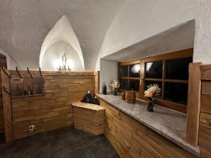 a large room with a counter with flowers on it at Appartement Steinblick -Obinghof- in Maishofen