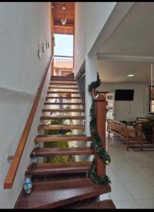 a stairway with christmas decorations in a building at Pedacinho do céu in Tiradentes