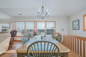 a dining room with a table and chairs at 3941 - Fleur de Duck in Duck +24 photos