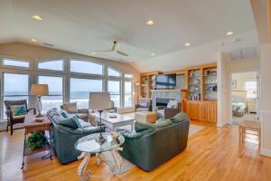 a living room with a couch and a table at 2869 - Seascape in Duck