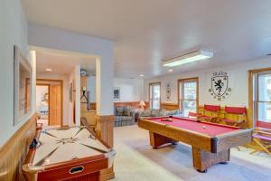 a living room with a pool table and ping pong ball at 4052 - Mirth N Mist II in Duck